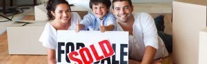 family-with-a-sold-sign
